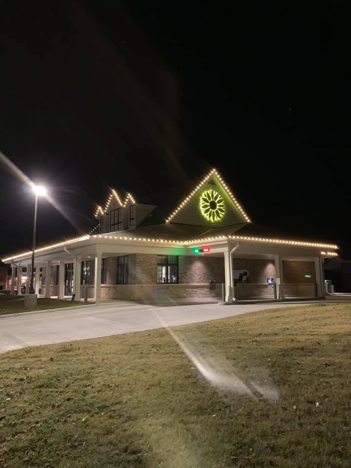 Commercial Building — warm white C9s & green wreath